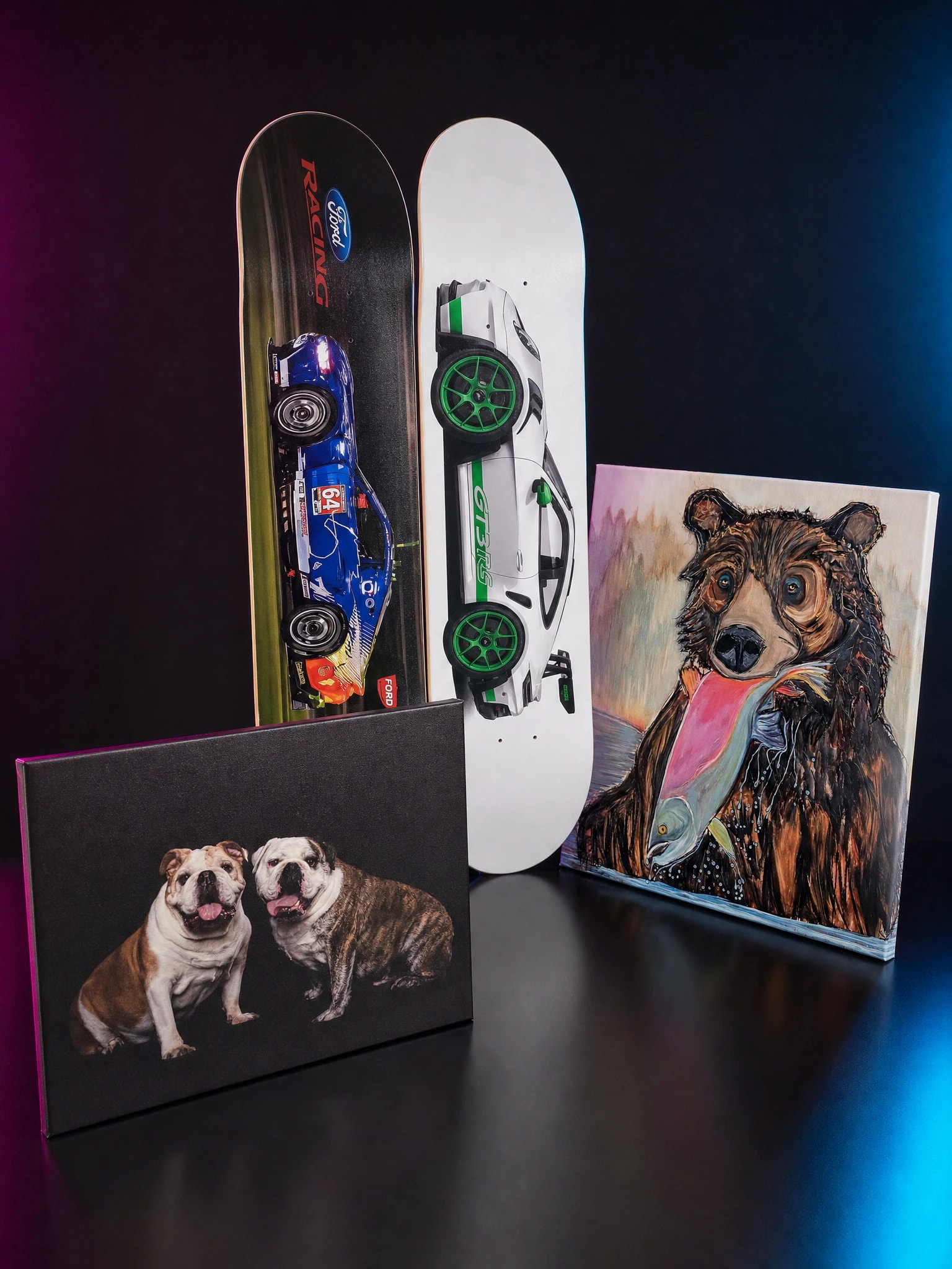 JAM-printed client work on a dark proof table — custom skateboard decks, a fine-art print, and a gallery-wrapped canvas