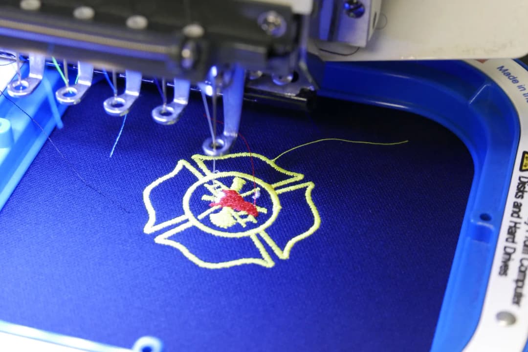 Fire department patch mid-stitch on the embroidery machine